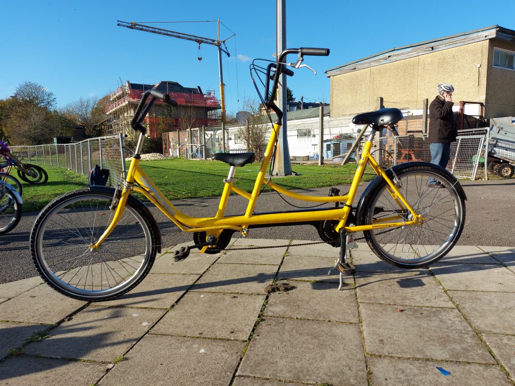 An adapted tandem bicycle for disabled cyclists