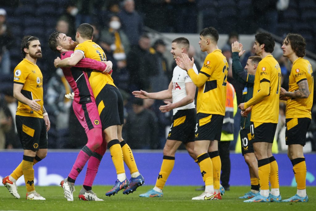 Wolverhampton Wanderers' goalkeeper Jose Sa celebrates with teammate Wolverhampton Wanderers' Conor Coady after the end of the English Premier League soccer match between Tottenham Hotspur and Wolverhampton Wanderers and at White Hart Lane in London, Sunday, Feb. 13, 2022.Wolves won the game 2-0. (AP Photo/David Cliff)