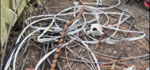 Metal and wire cables picked out of River Roding 